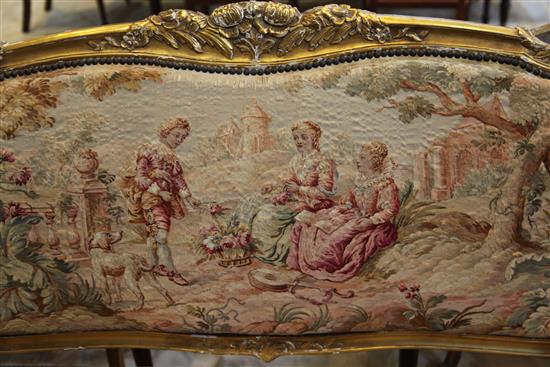 A Louis XV style floral carved three piece suite,